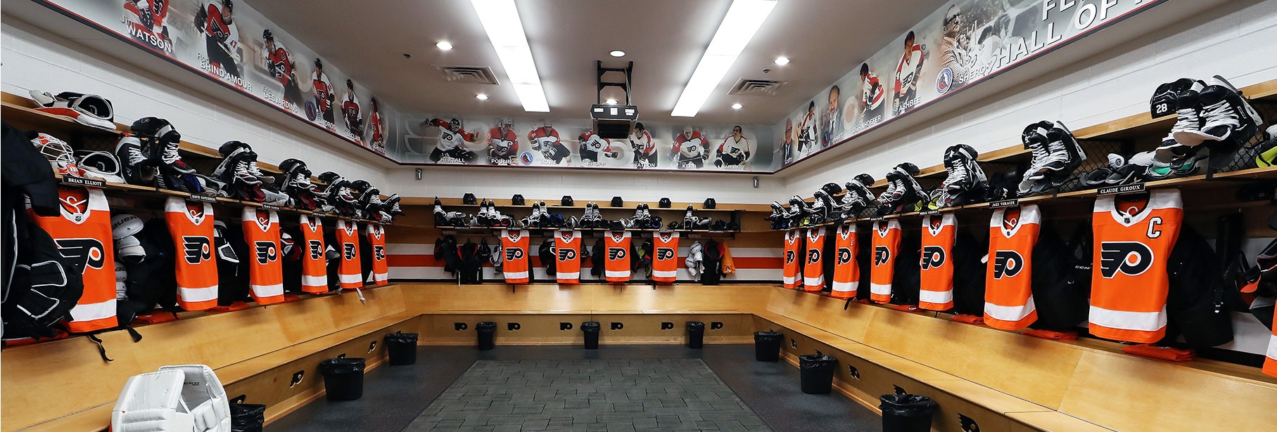Wide shot of the Flyers’ equipment set up in their home locker room
